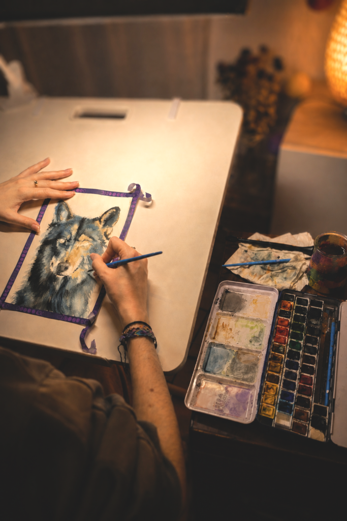 Mena, watercolour artist, in her studio